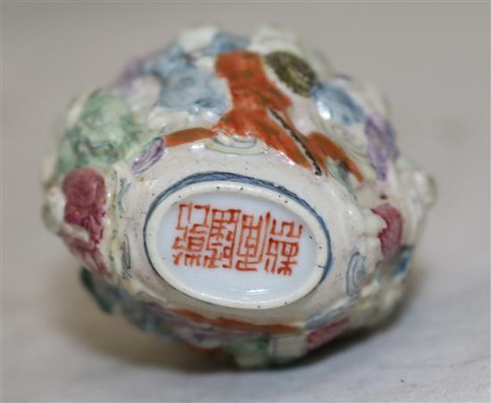 Two Chinese moulded famille rose eighteen luohan snuff bottles, Qianlong marks, but 1821-50, height 7.2cm, one with rim chips